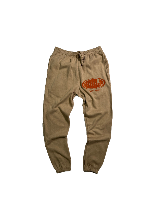 1.SMALL TAN SUIT WITH BURNT ORANGE LOGO